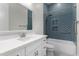 Modern bathroom with blue patterned tile and quartz countertop at 3326 E Ivyglen Cir, Mesa, AZ 85213