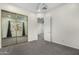 Bedroom with mirrored closet doors and ceiling fan at 3326 E Ivyglen Cir, Mesa, AZ 85213