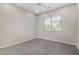 Bright bedroom with ceiling fan and window blinds at 3326 E Ivyglen Cir, Mesa, AZ 85213