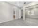 Bright bedroom with mirrored closet and ceiling fan at 3326 E Ivyglen Cir, Mesa, AZ 85213