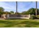 Community entrance with stone wall and landscaping at 3326 E Ivyglen Cir, Mesa, AZ 85213