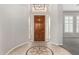 Bright entryway with tile floor and chandelier at 3326 E Ivyglen Cir, Mesa, AZ 85213