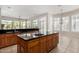 Spacious kitchen featuring granite countertops and island at 3326 E Ivyglen Cir, Mesa, AZ 85213