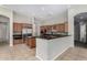 Modern kitchen with granite countertops and breakfast bar at 3326 E Ivyglen Cir, Mesa, AZ 85213