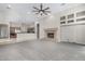 Spacious living room with fireplace and access to backyard pool at 3326 E Ivyglen Cir, Mesa, AZ 85213