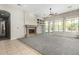 Living room features a fireplace and view to backyard at 3326 E Ivyglen Cir, Mesa, AZ 85213