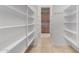 Walk-in pantry with ample shelving for storage at 3326 E Ivyglen Cir, Mesa, AZ 85213