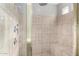 Spacious shower with built-in seat and tiled walls at 3326 E Ivyglen Cir, Mesa, AZ 85213