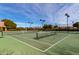 Well-lit tennis and pickleball courts at 3326 E Ivyglen Cir, Mesa, AZ 85213