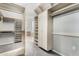 Large walk-in closet with shelving and hanging rods at 3326 E Ivyglen Cir, Mesa, AZ 85213