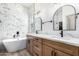 Bathroom with marble tile, double vanity, and large soaking tub at 3390 S Yaqui Ln, Gold Canyon, AZ 85118