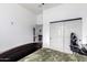 Simple bedroom with large closet and gaming chair at 3390 S Yaqui Ln, Gold Canyon, AZ 85118