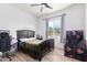 Serene bedroom with a large window, desk, and basketball hoop at 3390 S Yaqui Ln, Gold Canyon, AZ 85118