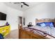 Cozy bedroom with wood bed frame and yellow accent furniture at 3390 S Yaqui Ln, Gold Canyon, AZ 85118