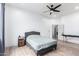 Spacious bedroom with ceiling fan and barn door to bathroom at 3390 S Yaqui Ln, Gold Canyon, AZ 85118