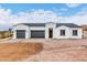 New construction home with two-car garage and desert landscaping at 3390 S Yaqui Ln, Gold Canyon, AZ 85118