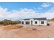 New construction home with two-car garage and mountain backdrop at 3390 S Yaqui Ln, Gold Canyon, AZ 85118