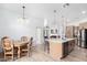 Modern kitchen with an island, stainless steel appliances, and wood cabinets at 3390 S Yaqui Ln, Gold Canyon, AZ 85118