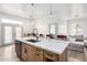 Modern kitchen with large island, stainless steel appliances, and light wood cabinets at 3390 S Yaqui Ln, Gold Canyon, AZ 85118