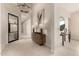 Inviting foyer featuring a chandelier, modern art, and views into the home's interior at 37178 N Winding Wash Trl, Carefree, AZ 85377