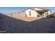 Sandy backyard with block wall and covered patio at 3818 S 84Th Ln, Tolleson, AZ 85353