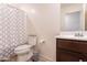 Bathroom with single vanity, toilet, and shower/tub combo at 3818 S 84Th Ln, Tolleson, AZ 85353