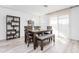 Bright dining area with a table and chairs near a window at 3818 S 84Th Ln, Tolleson, AZ 85353