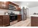 Stainless steel appliances and granite countertops in this new kitchen at 3818 S 84Th Ln, Tolleson, AZ 85353