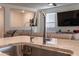 Modern kitchen sink with a high-arc faucet and filtered water dispenser at 3818 S 84Th Ln, Tolleson, AZ 85353