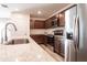 Modern kitchen featuring stainless steel appliances and granite countertops at 3818 S 84Th Ln, Tolleson, AZ 85353