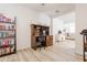 Home office with a desk, chair, and built-in shelving at 3818 S 84Th Ln, Tolleson, AZ 85353