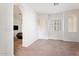 Bright bedroom with neutral carpeting and large window at 3935 E Rough Rider Rd # 1270, Phoenix, AZ 85050