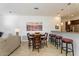 Dining area with a round table and chairs, adjacent to the kitchen at 3935 E Rough Rider Rd # 1270, Phoenix, AZ 85050