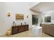 Bright living room with tiled floors, sliding glass door, and a wooden media console at 3935 E Rough Rider Rd # 1270, Phoenix, AZ 85050