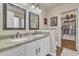 Double vanity bathroom with granite countertops, large mirror, and walk-in closet at 4028 N Ranier --, Mesa, AZ 85215