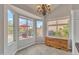 Breakfast nook with built-in wooden cabinet and view to backyard at 4028 N Ranier --, Mesa, AZ 85215