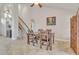 Cozy dining area with wooden table and chairs near staircase at 4028 N Ranier --, Mesa, AZ 85215