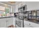 Modern kitchen with stainless steel appliances and white cabinets at 4028 N Ranier --, Mesa, AZ 85215