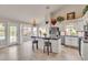 Bright kitchen with island, stainless steel appliances, and white cabinets at 4028 N Ranier --, Mesa, AZ 85215