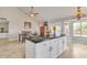 Kitchen with island, white cabinets, and stainless steel appliances at 4028 N Ranier --, Mesa, AZ 85215