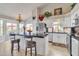 Bright kitchen with island, stainless steel appliances, and white cabinets at 4028 N Ranier --, Mesa, AZ 85215