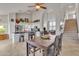 Open concept kitchen and dining area with island, stainless steel appliances, and tile flooring at 4028 N Ranier --, Mesa, AZ 85215