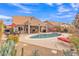 Stunning kidney shaped pool with a large patio and outdoor seating at 4028 N Ranier --, Mesa, AZ 85215