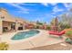 Relaxing kidney shaped pool with patio and lounge chairs at 4028 N Ranier --, Mesa, AZ 85215