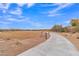 Paved walking trail through desert landscape at 4028 N Ranier --, Mesa, AZ 85215