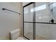 Modern bathroom featuring a glass enclosed shower with white subway tiles and a toilet at 4053 E Zion Way, Chandler, AZ 85249