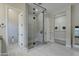 Bright bathroom showcasing a glass-enclosed shower with black hardware and neutral tile at 4053 E Zion Way, Chandler, AZ 85249