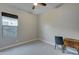 Cozy bedroom with a ceiling fan, window, and neutral walls and carpet at 4053 E Zion Way, Chandler, AZ 85249