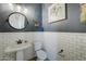 Stylish half bathroom with white subway tile and a pedestal sink at 4053 E Zion Way, Chandler, AZ 85249