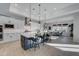 Modern kitchen with a center island, sleek countertops, and an open layout to the dining area at 4053 E Zion Way, Chandler, AZ 85249